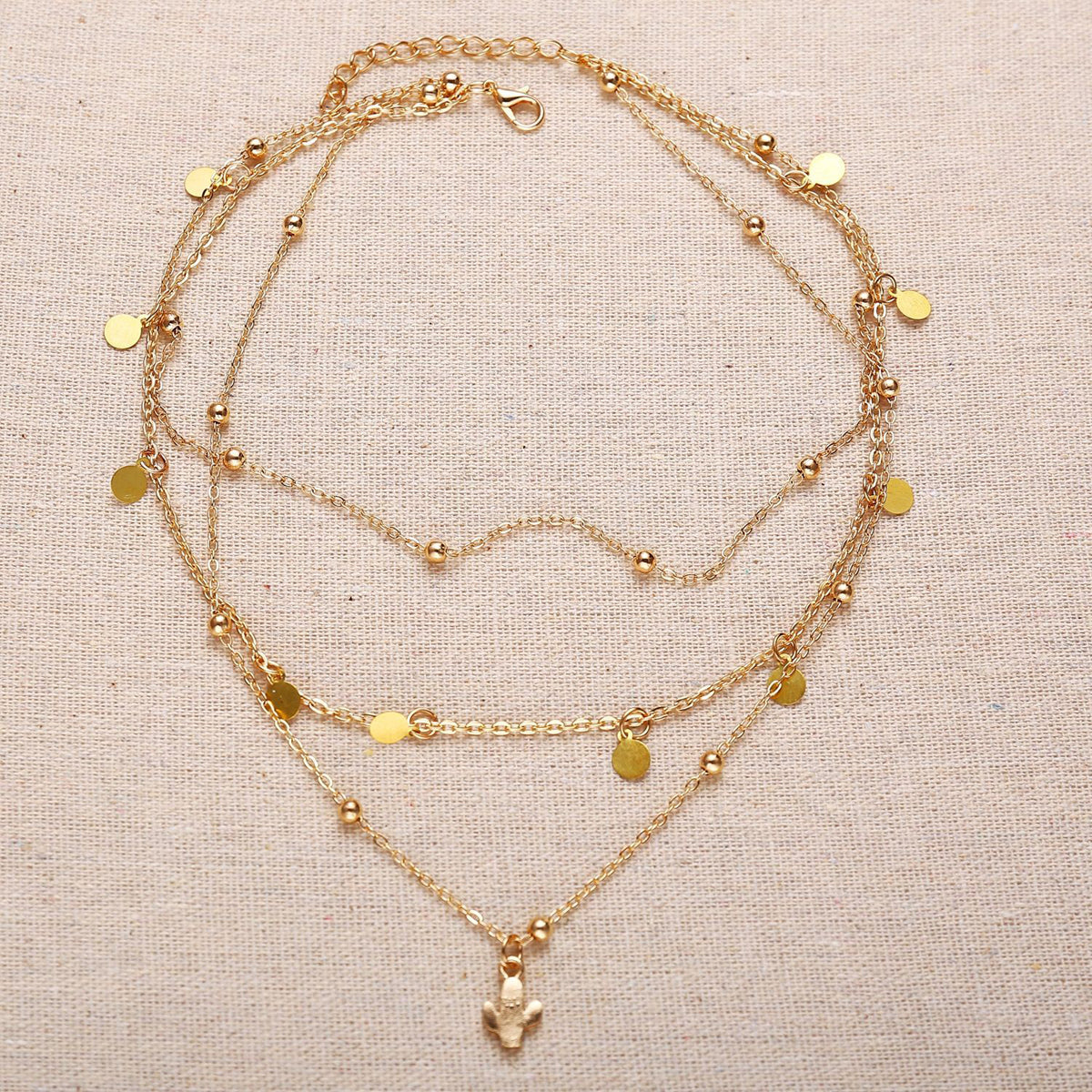 Scintillare by Sukkhi Shimmering Gold Plated Cross Multi Layered Necklace for Women