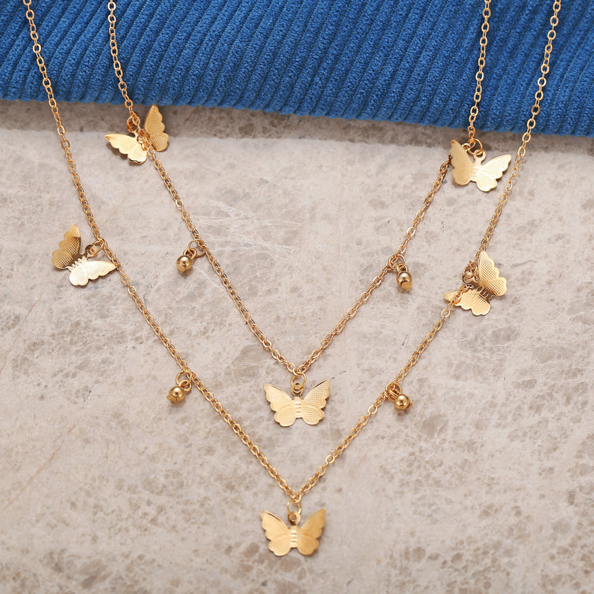 Scintillare by Sukkhi Adorable Gold Plated Multi Layered Butterfly Necklace for Women