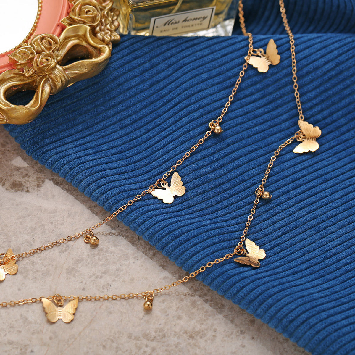 Scintillare by Sukkhi Adorable Gold Plated Multi Layered Butterfly Necklace for Women